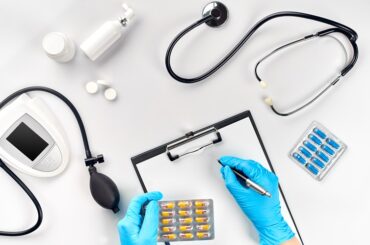 Doctor s table, tools, medical instruments, therapist tonometer, blood pressure, work in hospital on white background flat lay